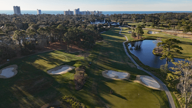 Pine Lakes 1st Green and Clubhouse Skyline